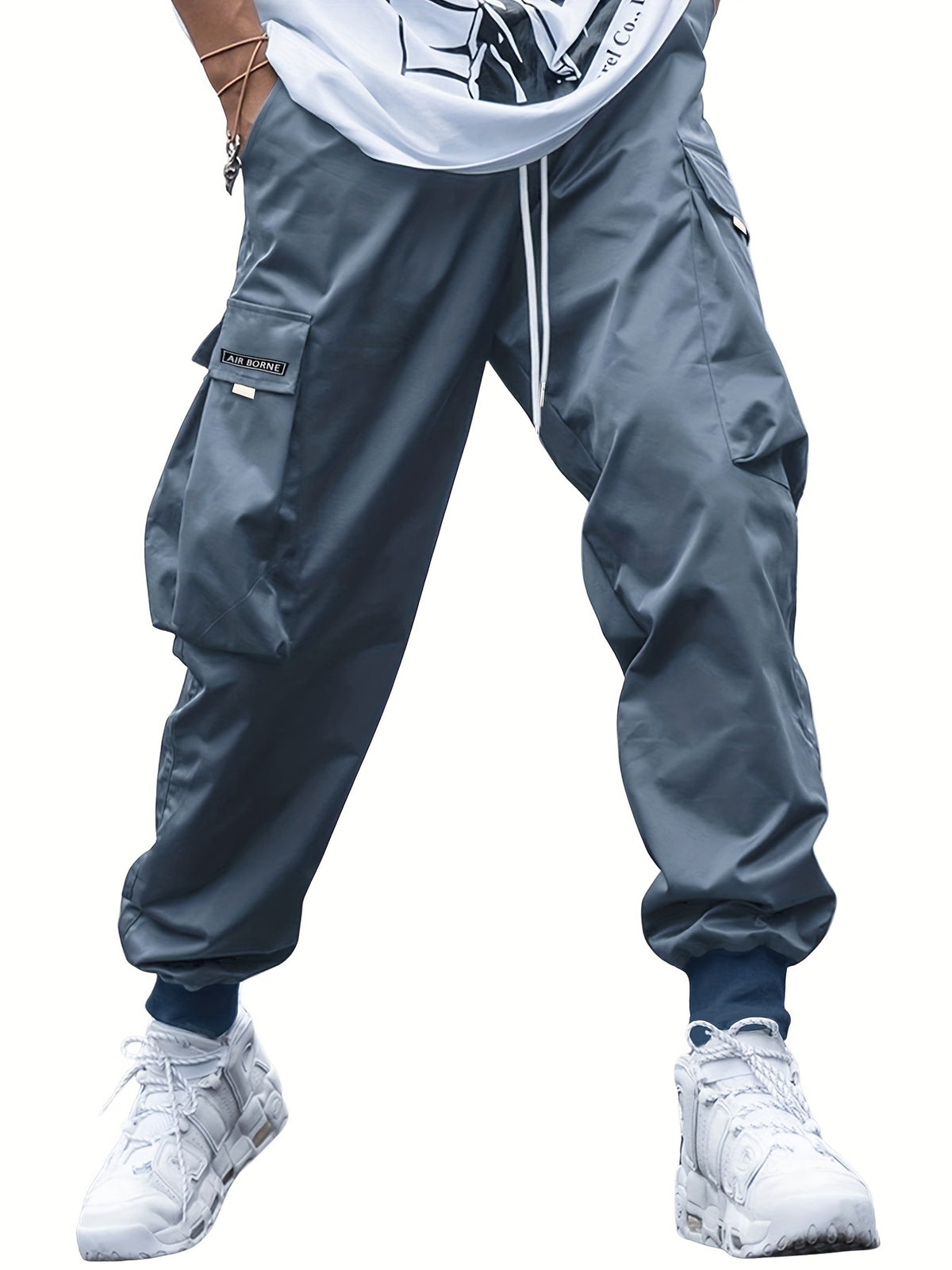 AdTec men's cargo pants with multiple pockets, blue-gray fabric, drawstring waist, Air Borne patch.