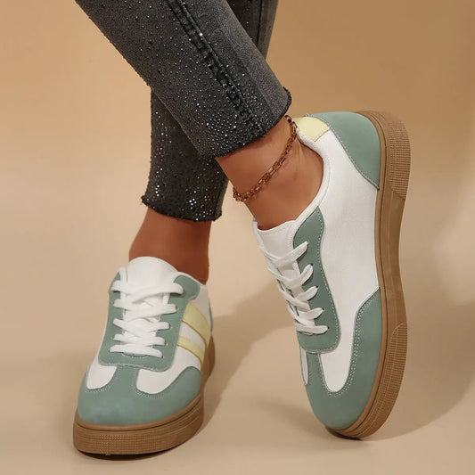 AdTec retro sports women's shoes, white with mint-green overlays and tan sole.