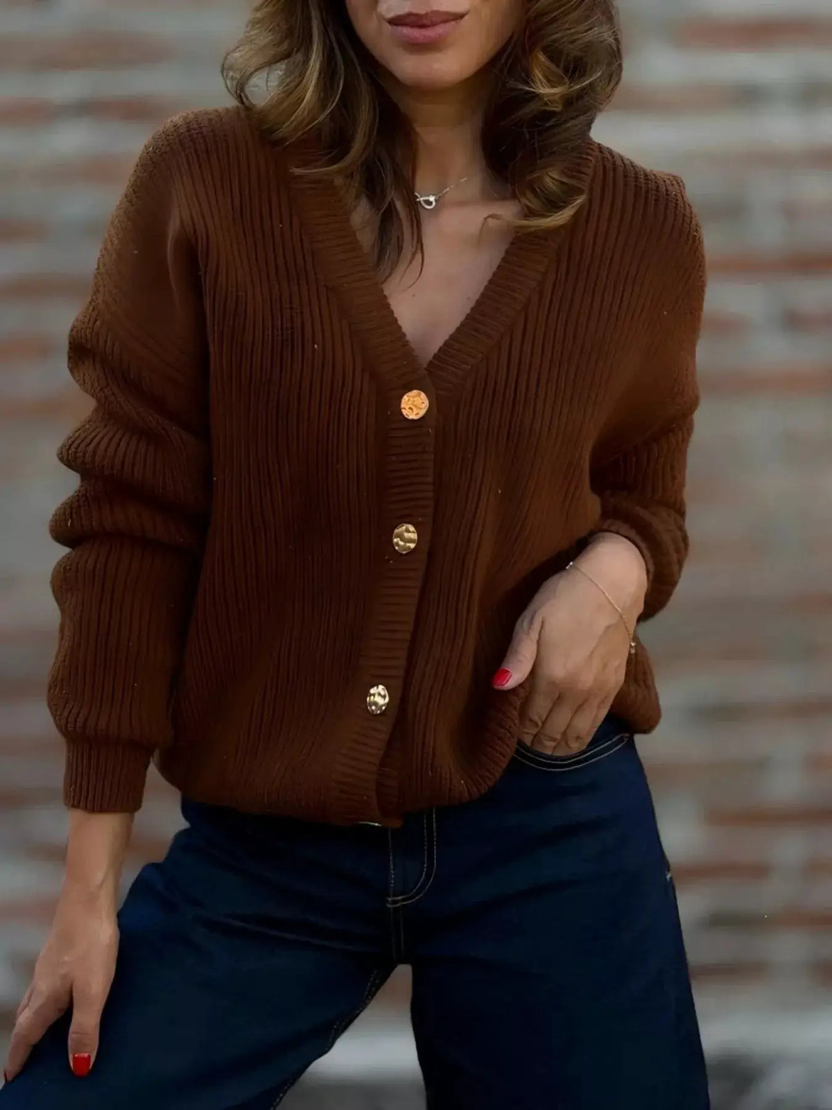 Plus size V-neck button-up knit cardigan in chocolate brown with ribbed texture and gold buttons, slight stretch.