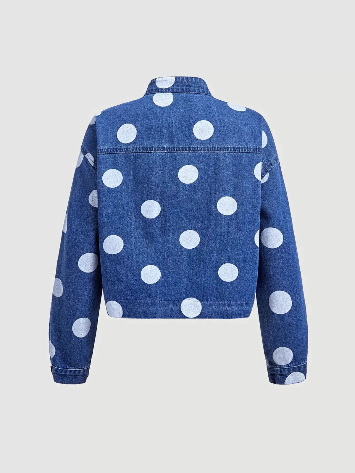Womens cropped denim jacket with white polka dots on blue jean fabric, open-front design