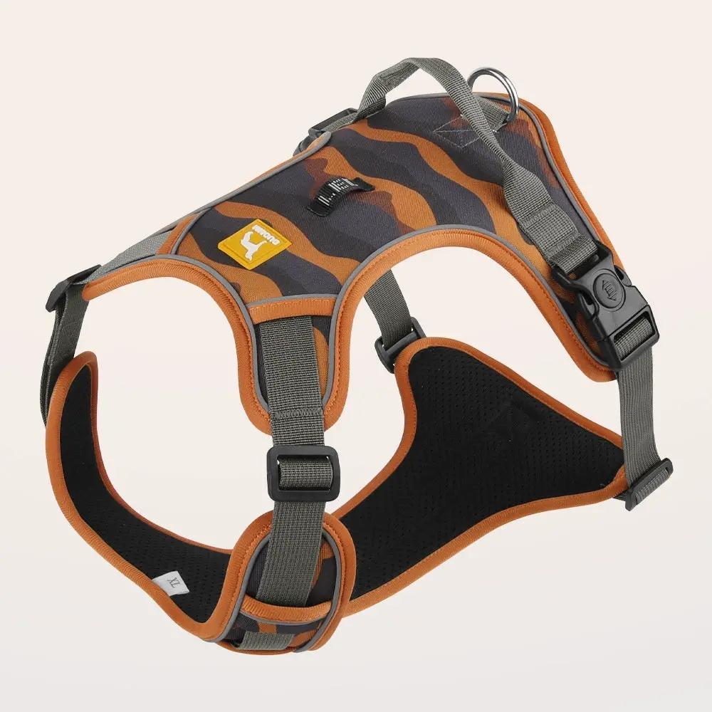 Dog harness by AdTec with reflective camo pattern, orange trim, chest and back straps, top handle