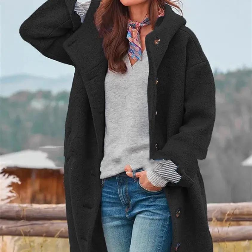 Womens heavy tweed winter coat, solid black textured fabric, long overcoat