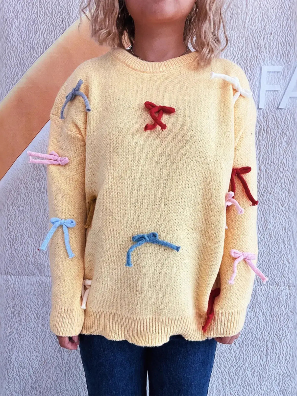 Vibrant bow-accent round-neck sweater for women, yellow knit pullover with pastel bow details