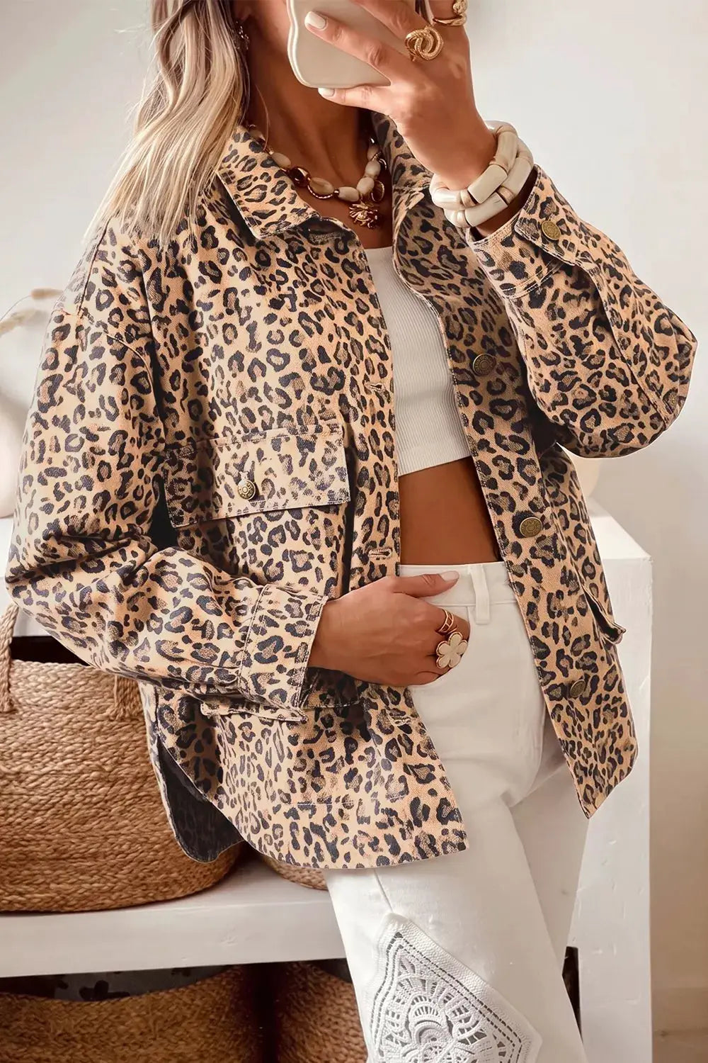 Leopard print denim trucker jacket by Trendsi with button front and side pockets