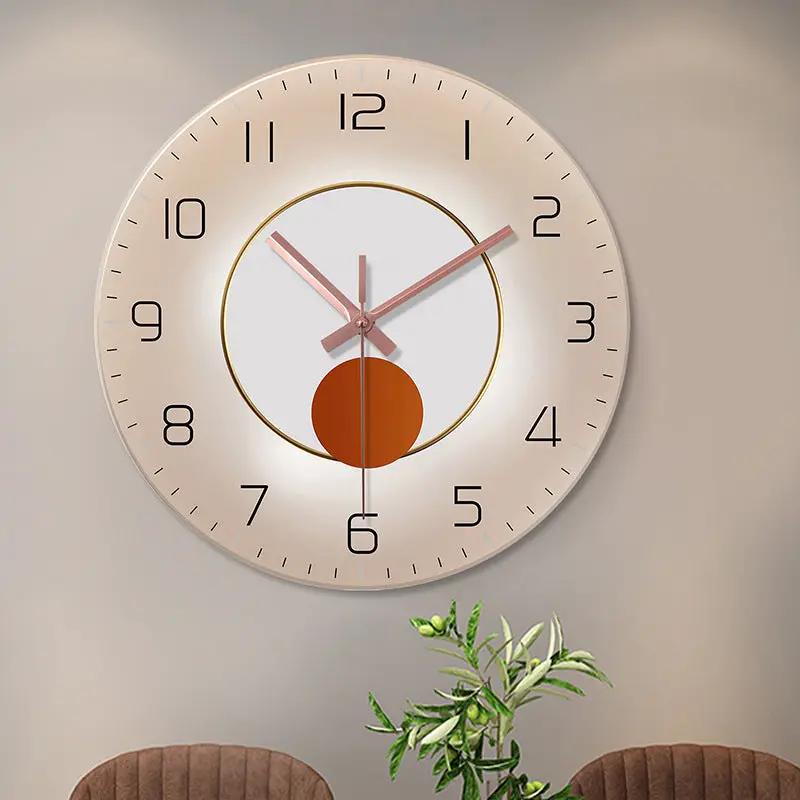 Wall-mounted decorative clock with rose-gold hands, white dial, black numerals and a gold ring.