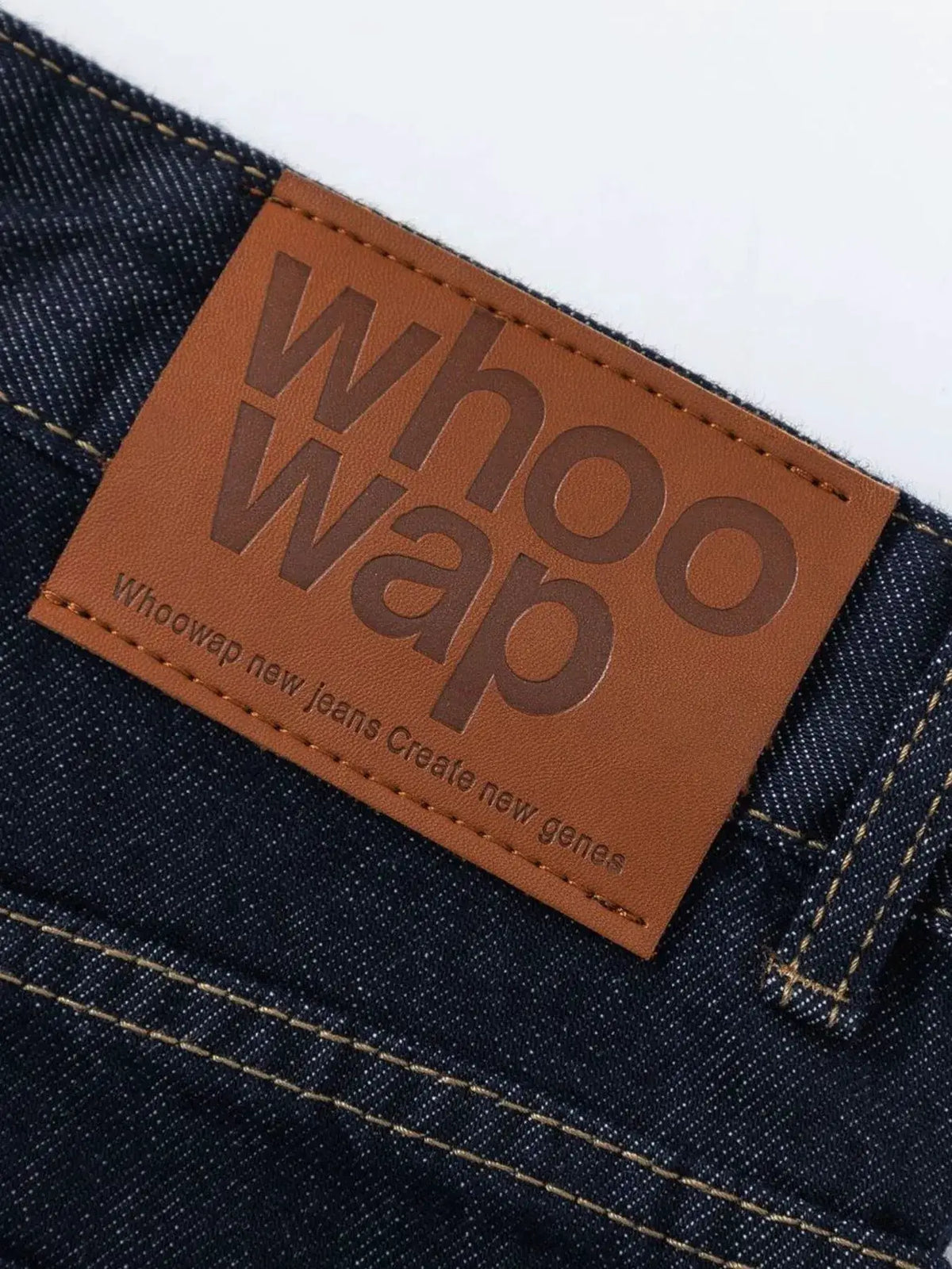 Men's wide-leg pure cotton denim shorts with brown leather patch.