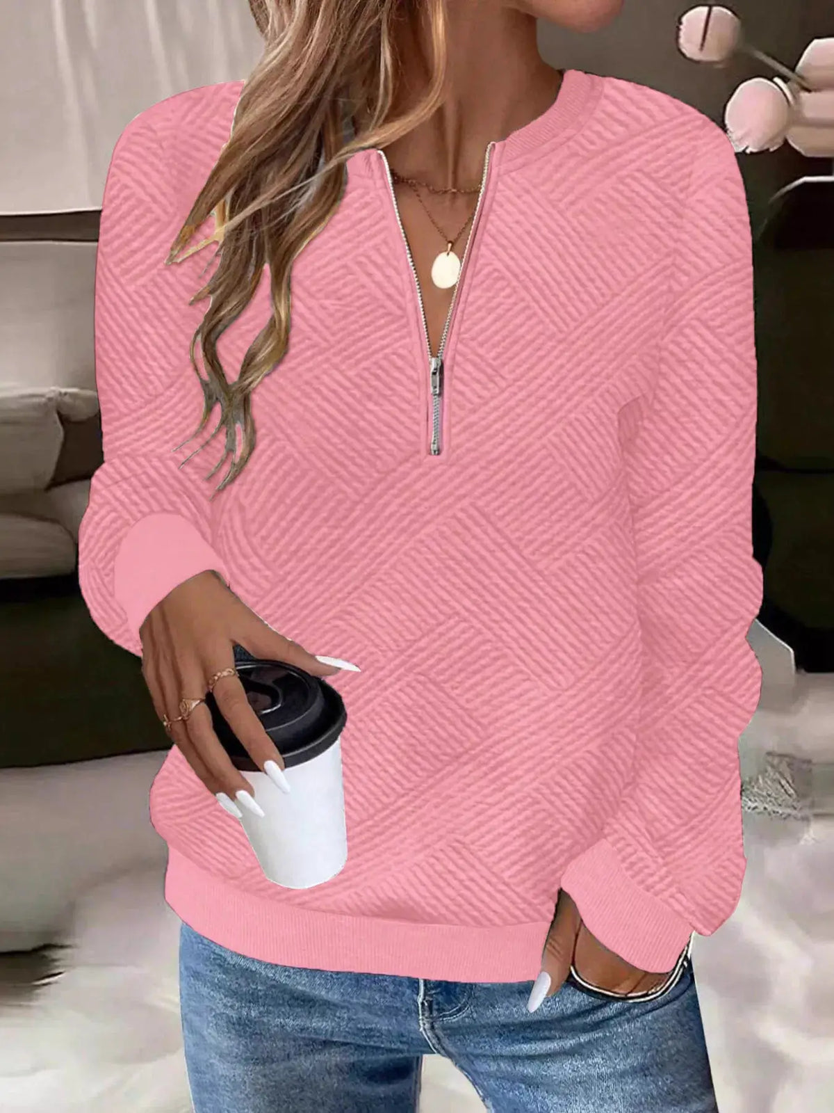 Textured pink quarter-zip sweatshirt by Trendsi with a quilted knit pattern and front zipper.