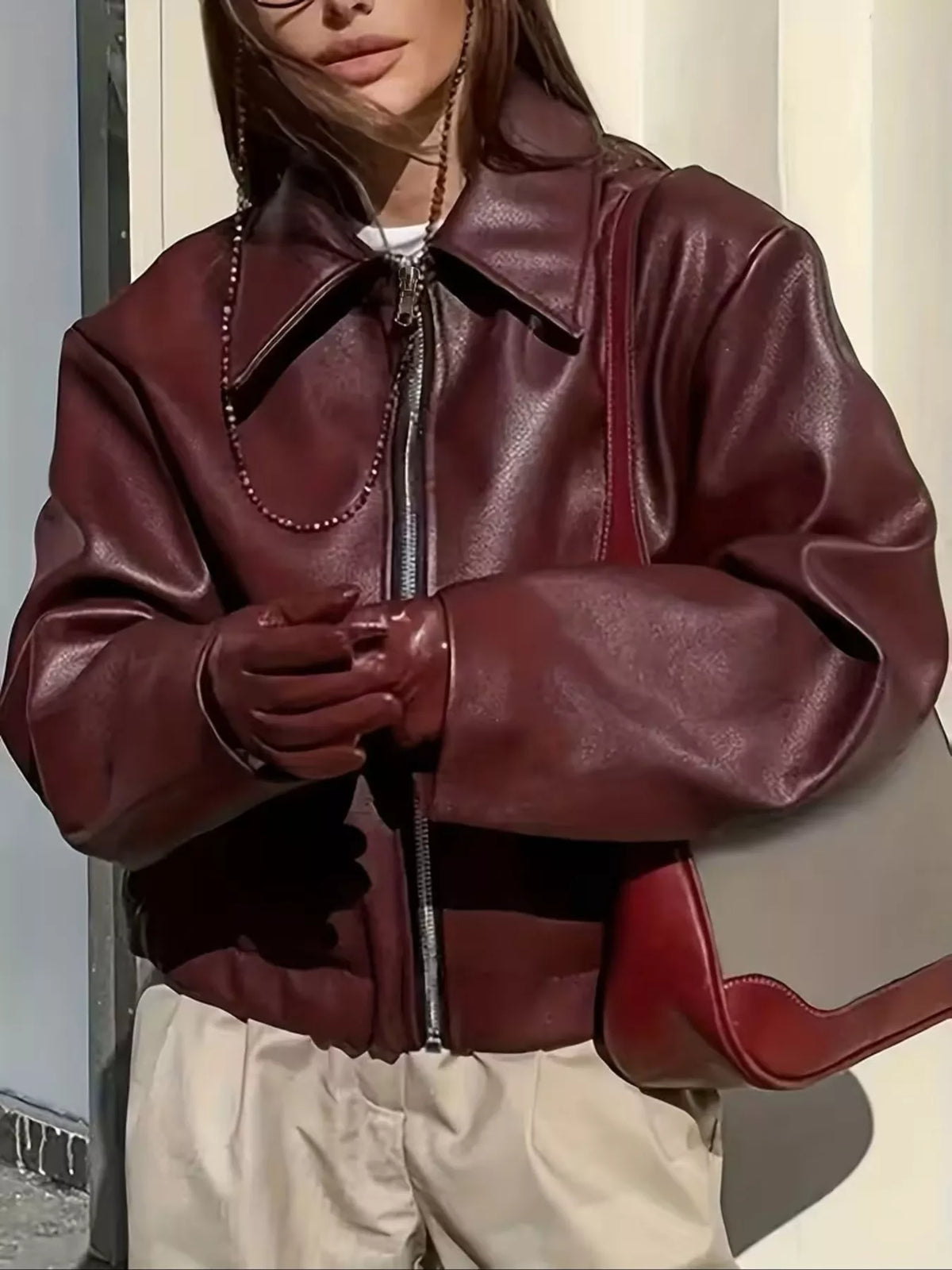 Oversized faux-leather moto jacket in burgundy with a full-zip front