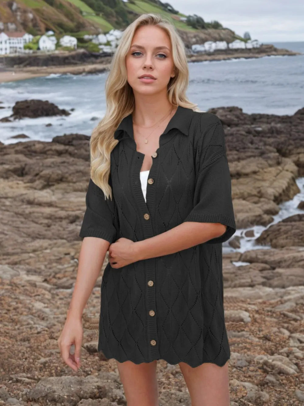 Womens black eyelet-knit button-down shirt with collared neck and short sleeves