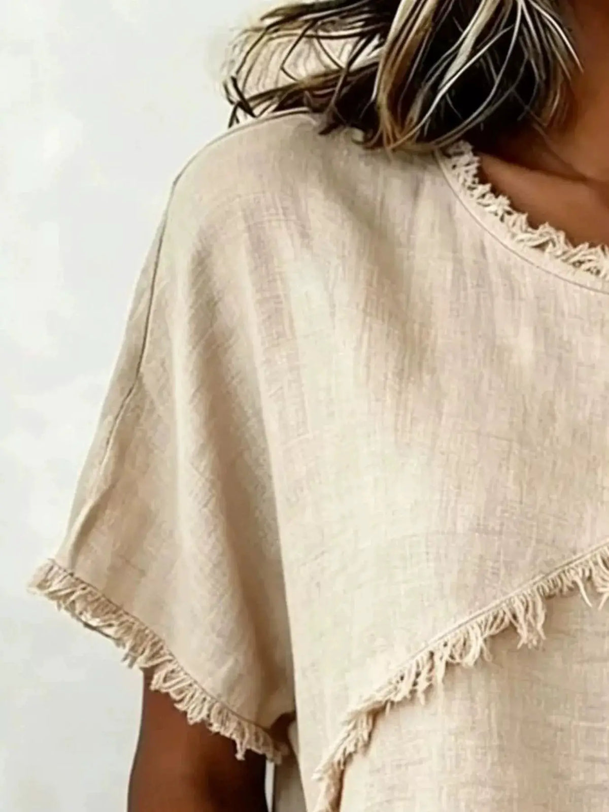 Full Size Frayed Hem Short Sleeve Top Plus Size by Trendsi, beige linen-like fabric with fringe trim