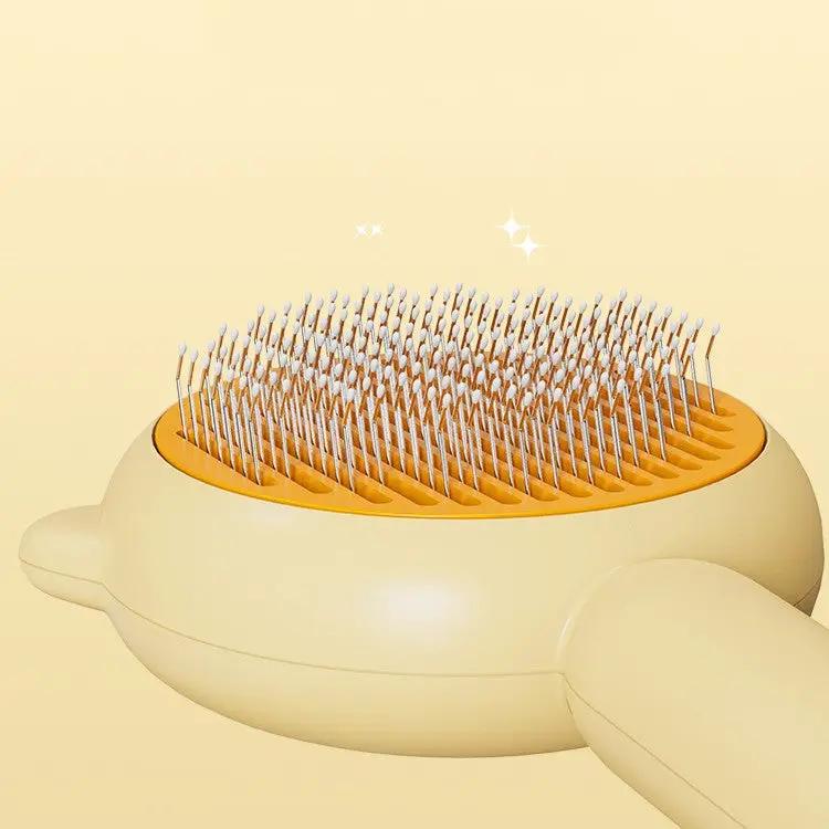 AdTec cat and dog grooming brush with metal pins in yellow ergonomic design