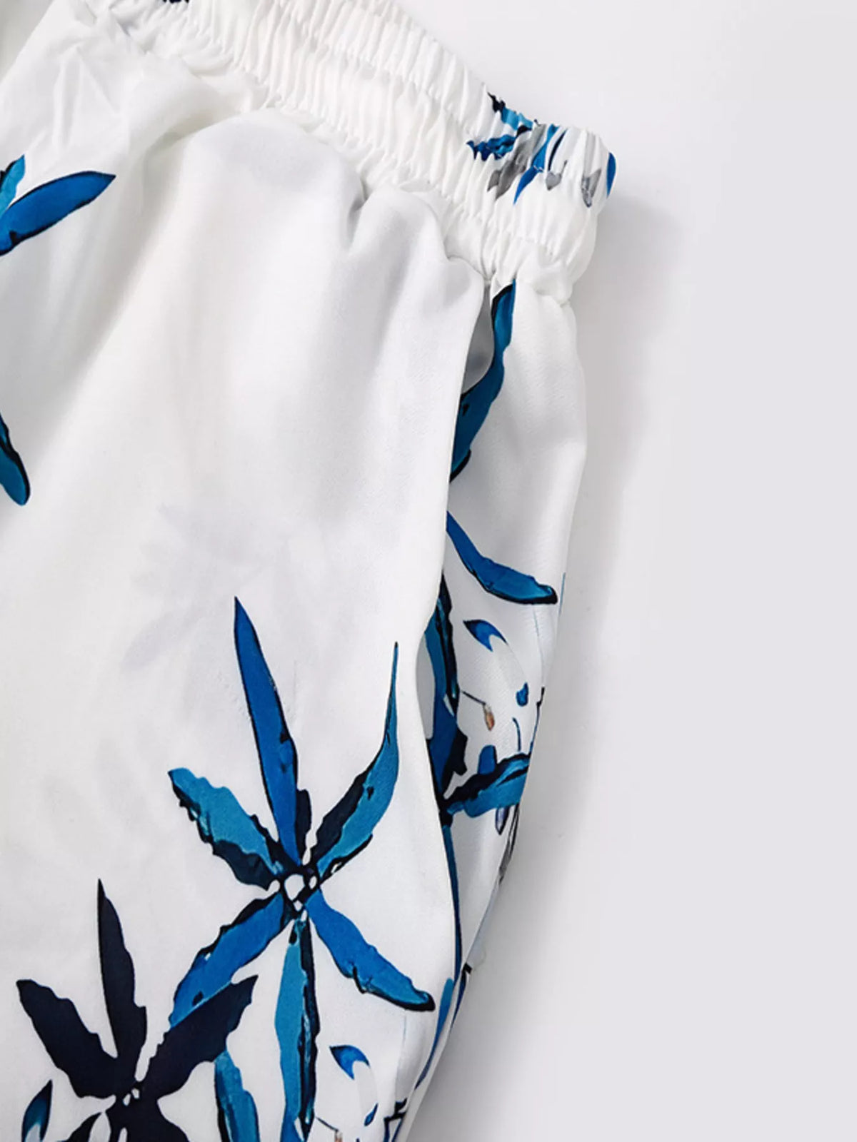 Men's tropical print short sleeve shirt and shorts set plus size by Trendsi, white with blue leaf design