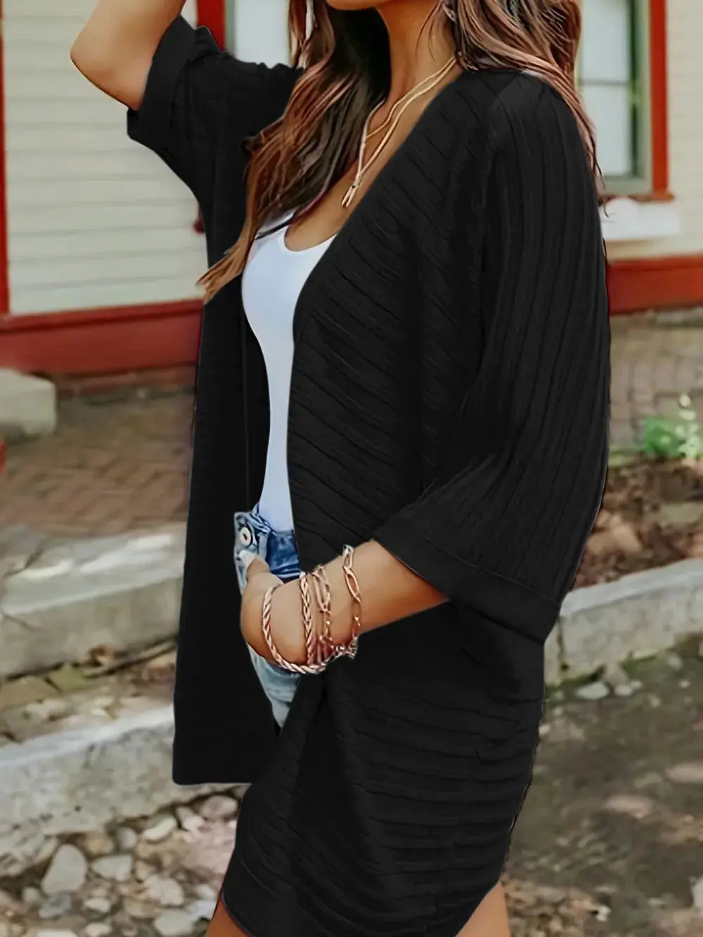 Striped open-front knit acrylic cardigan in black, relaxed layering piece