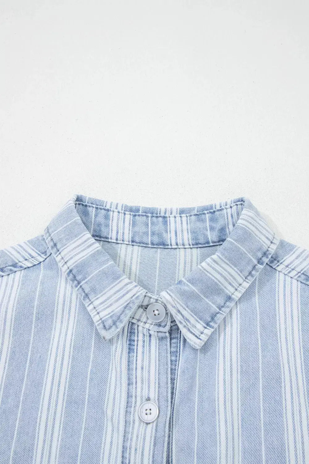 Striped light blue denim shacket with collar, chest pocket and raw hem