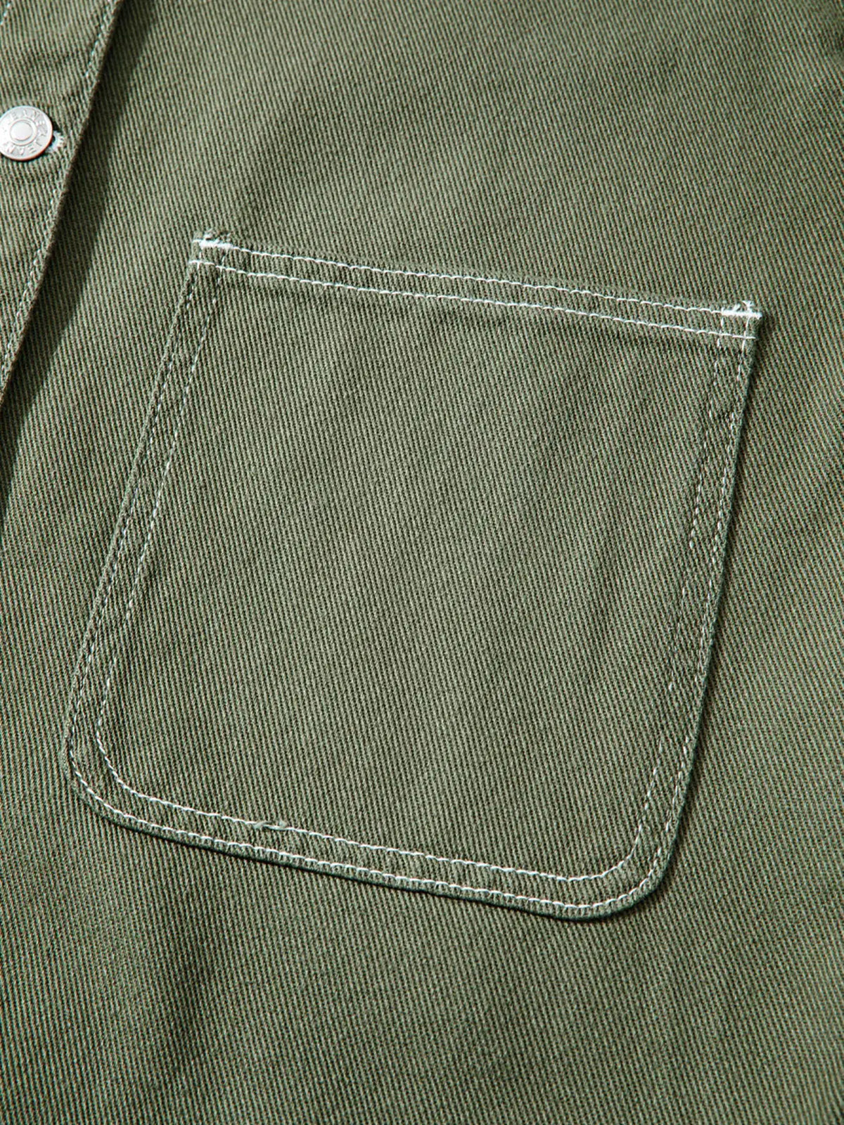 Boyfriend denim jacket with patch front pockets and button closure in olive-green denim