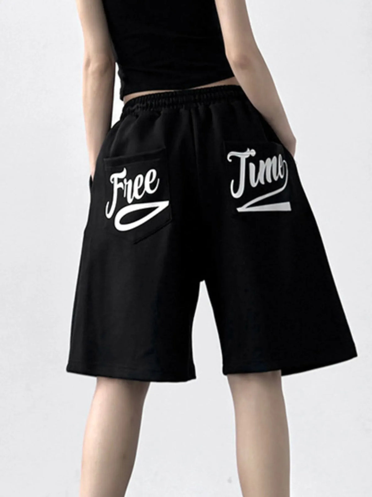 Drawstring Wide Leg Shorts, black pocketed jogger shorts with white script pockets reading Free Jump