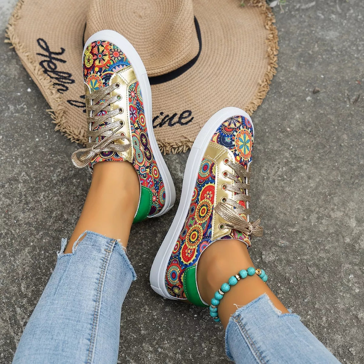 Printed Round Toe Sneakers by Trendsi, multicolor print with gold laces and white sole (2 shoes shown).