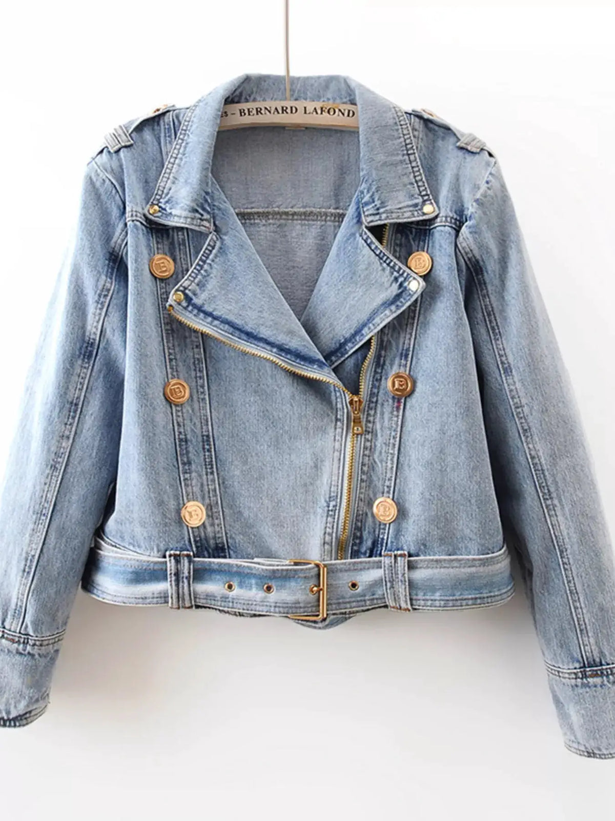 Asymmetrical Zip Front Belted Denim Jacket by Trendsi, light-wash blue denim with gold hardware