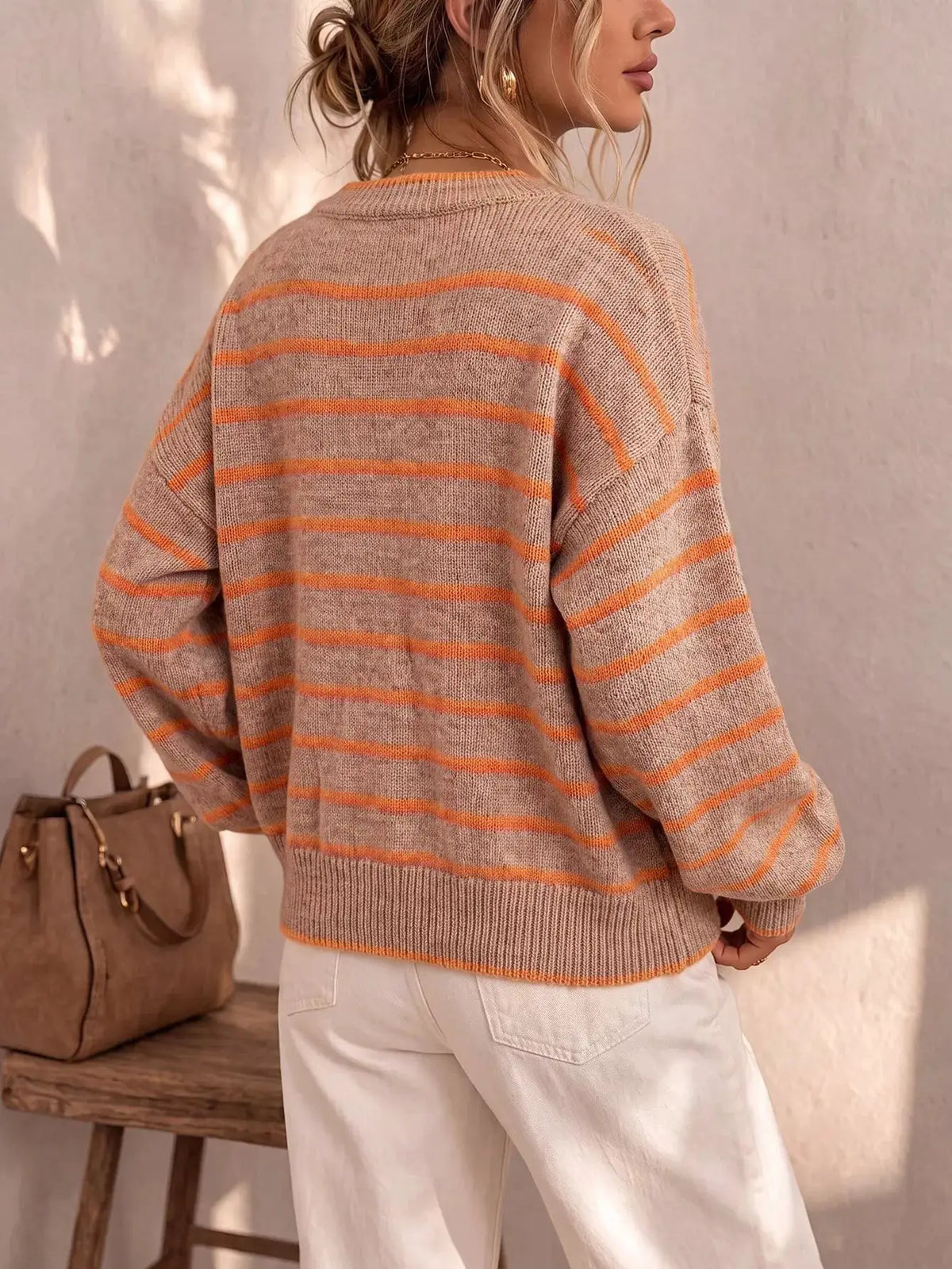 Striped button-down knit cardigan by Trendsi; beige base with orange stripes, oversized fit, back view