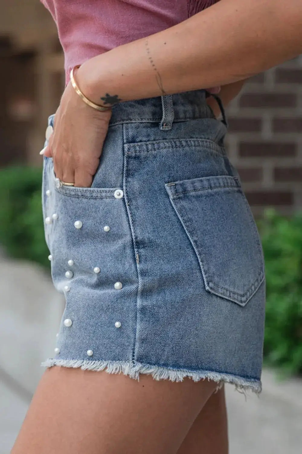 Classic Pearl Beaded Denim Shorts, blue washed cotton blend with a raw frayed hem and pearl bead detailing.