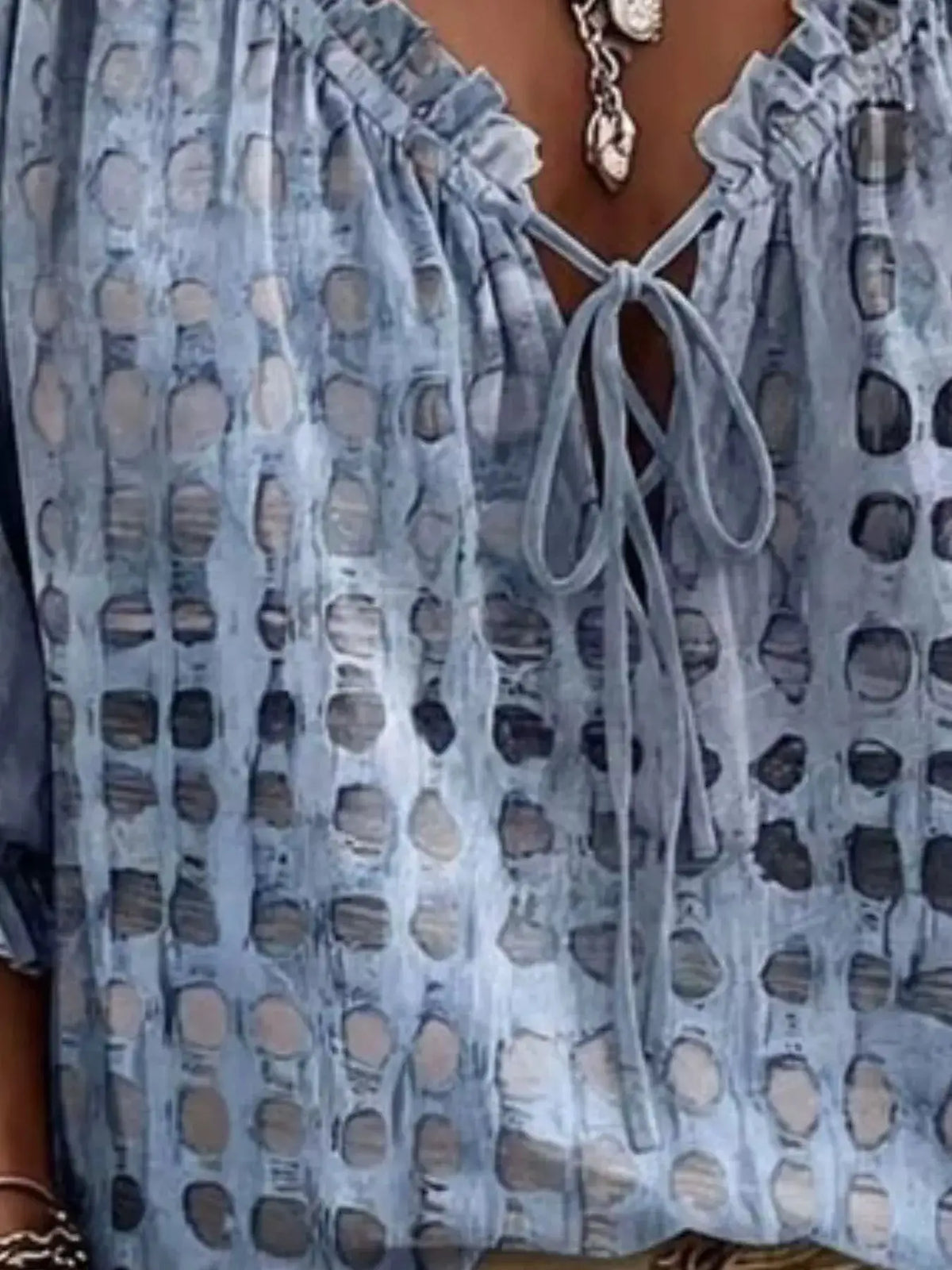 Plus-size full-size tie-neck blouse, light blue sheer fabric with circular pattern, 3/4 sleeves