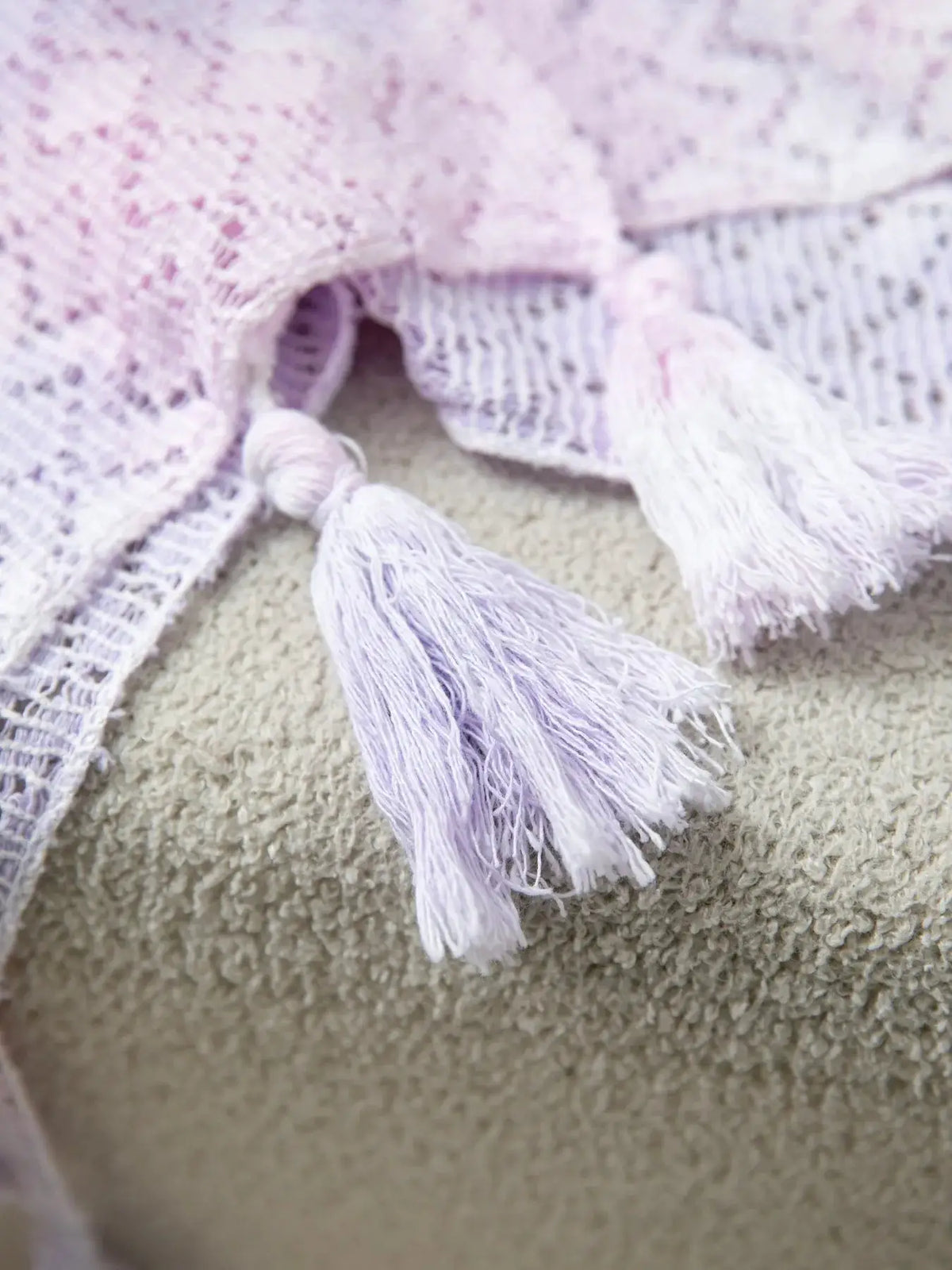Lightweight gradient openwork knit tassel beach cover-up in lavender-pink with fringe tassels