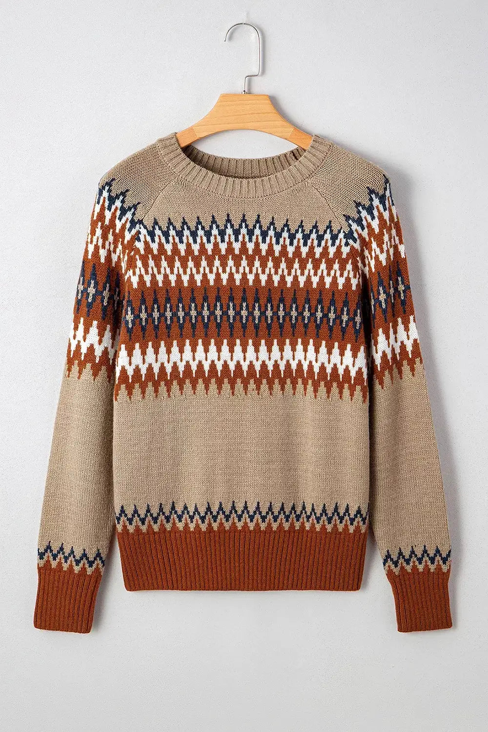 Geometric Pattern Long Sleeve Sweater; beige base with rust, navy, white zigzag motifs, crew neck, ribbed cuffs.