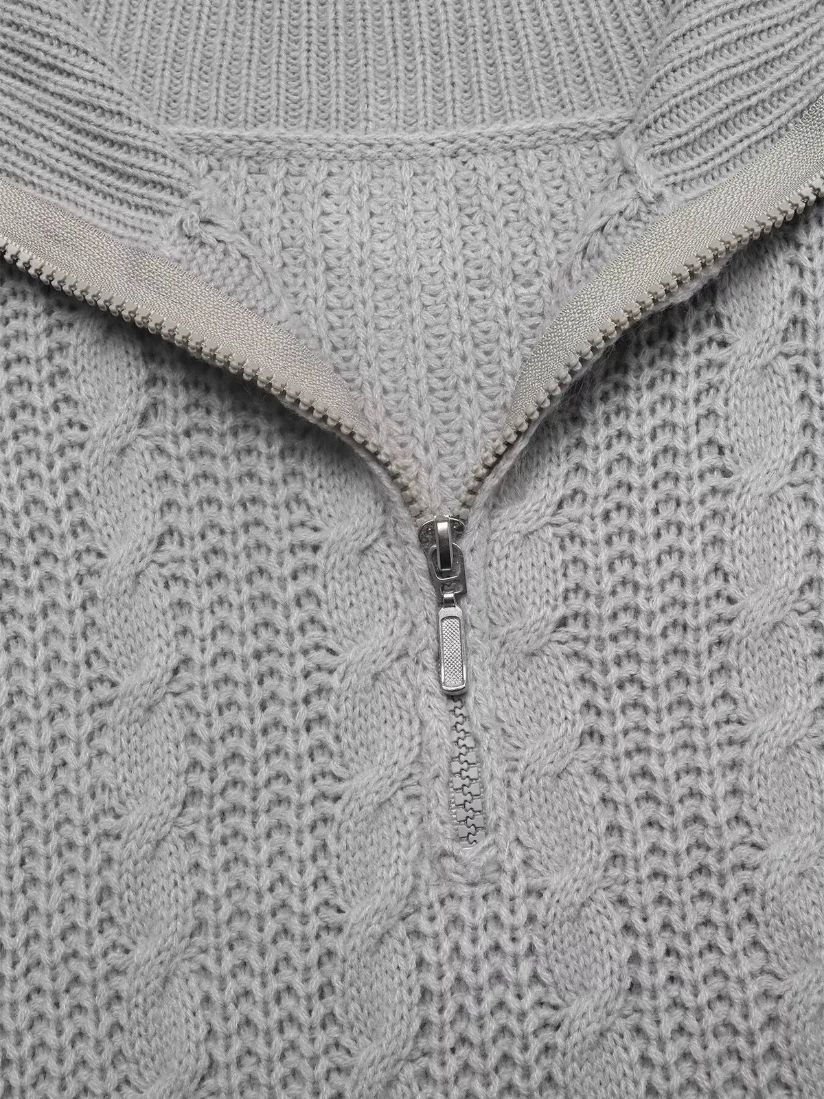 Cable-knit half-zip sweater in light gray acrylic; machine washable.