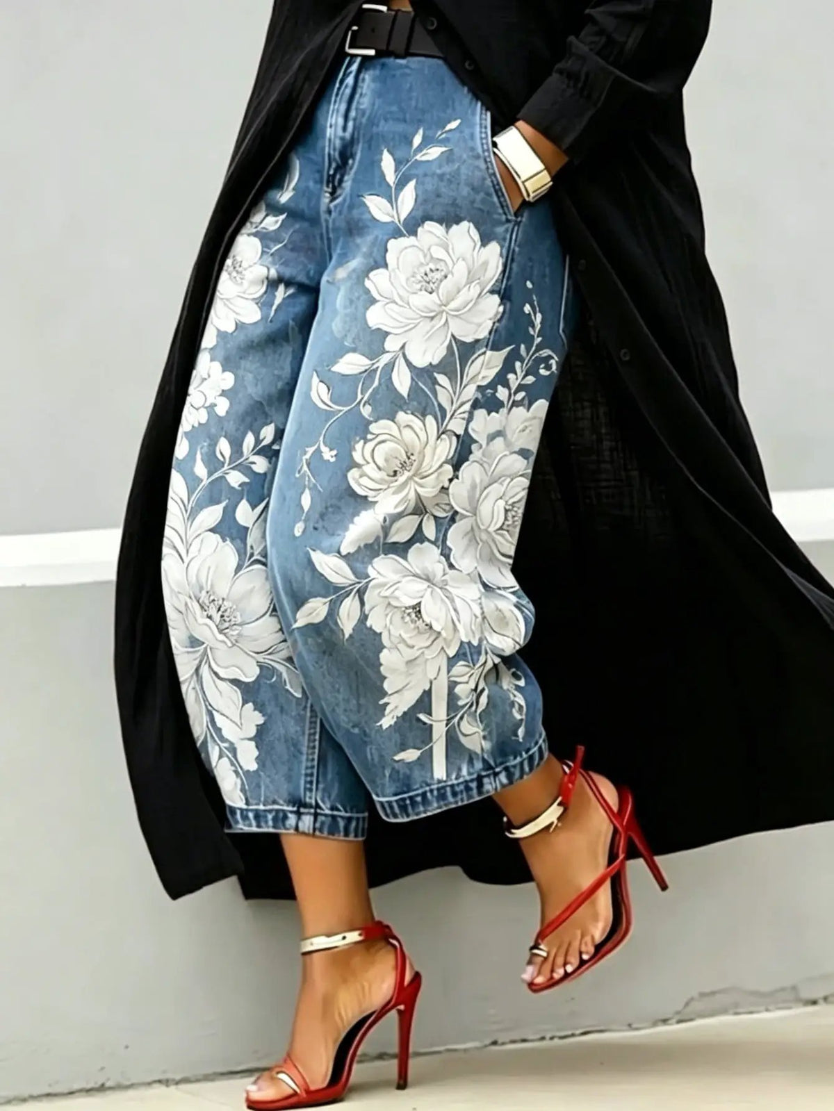 Blue floral-print denim capri jeans with a mid-rise and wide-leg fit.