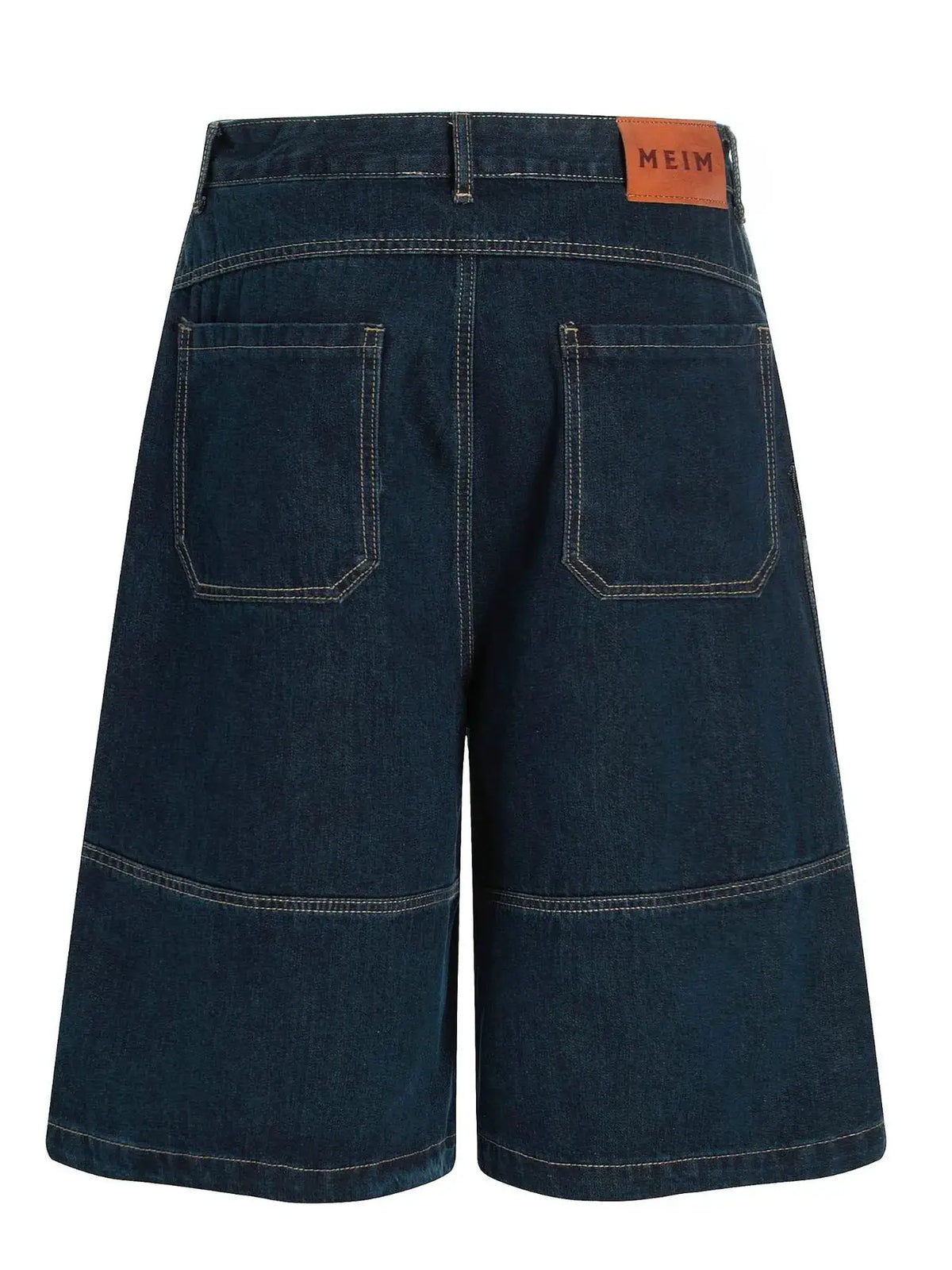 Mens wide-leg denim shorts in dark indigo cotton with tan contrast stitching and MEIM leather patch