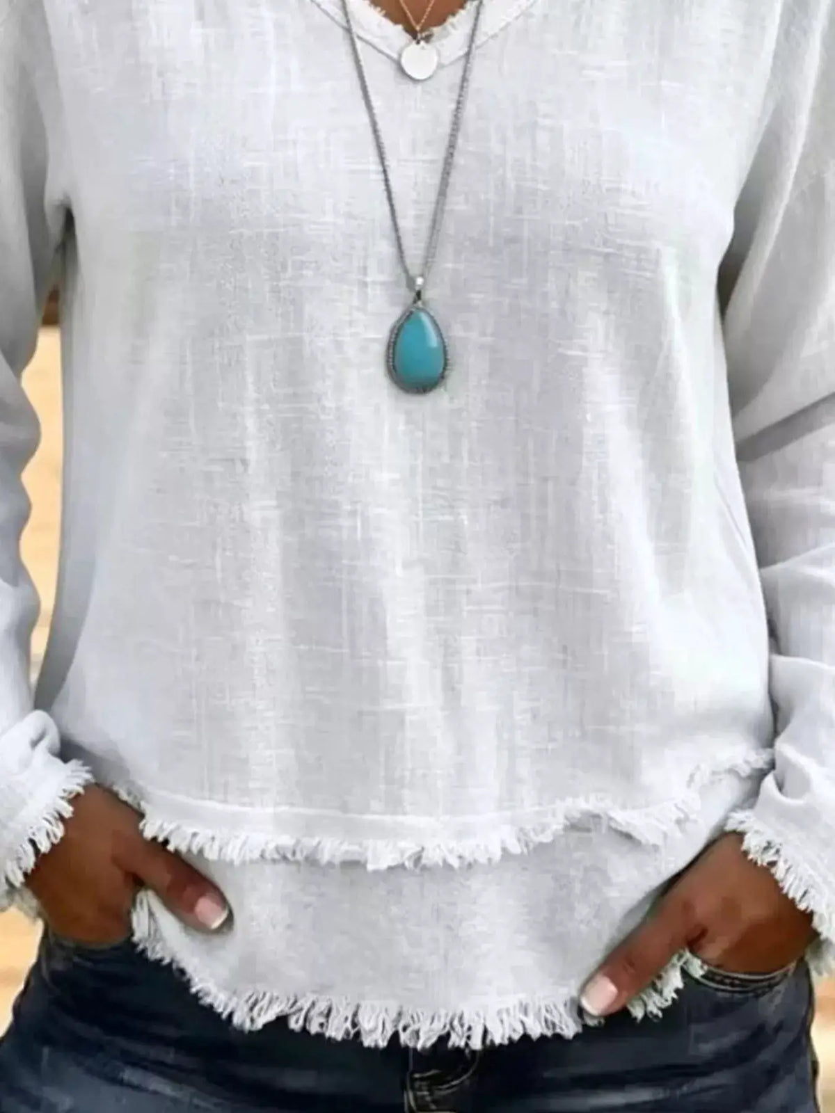 V-Neck Frayed Hem Long Sleeve T-Shirt in light gray with a distressed fringe hem