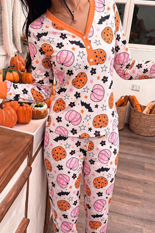 Halloween pumpkin-print long-sleeve lounge set on white with orange trim; top and pants.