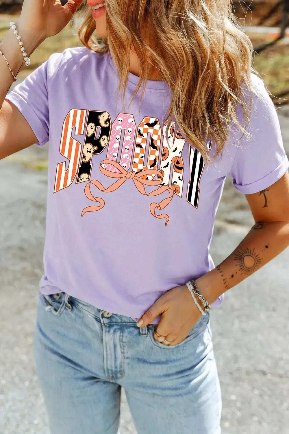 Halloween Spooky Letter Graphic T-shirt in lavender with multicolor letters and a pink bow