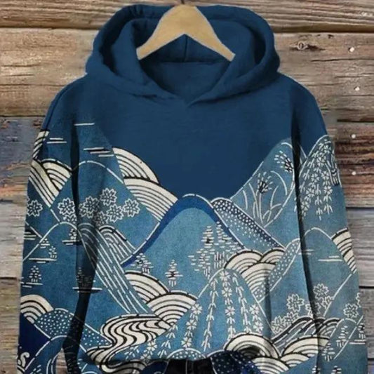 Womens hooded long-sleeve pullover sweatshirt in blue with floral mountain print.
