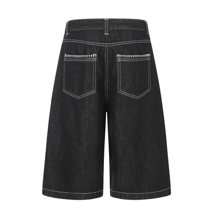 Pantalon de travail à jambe droite, boutonné, longueur cinq-quarts, avec poches et coutures color block.