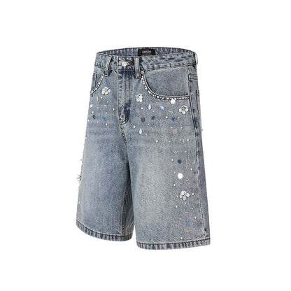 Short en jean lavé orné de perles fait à la main