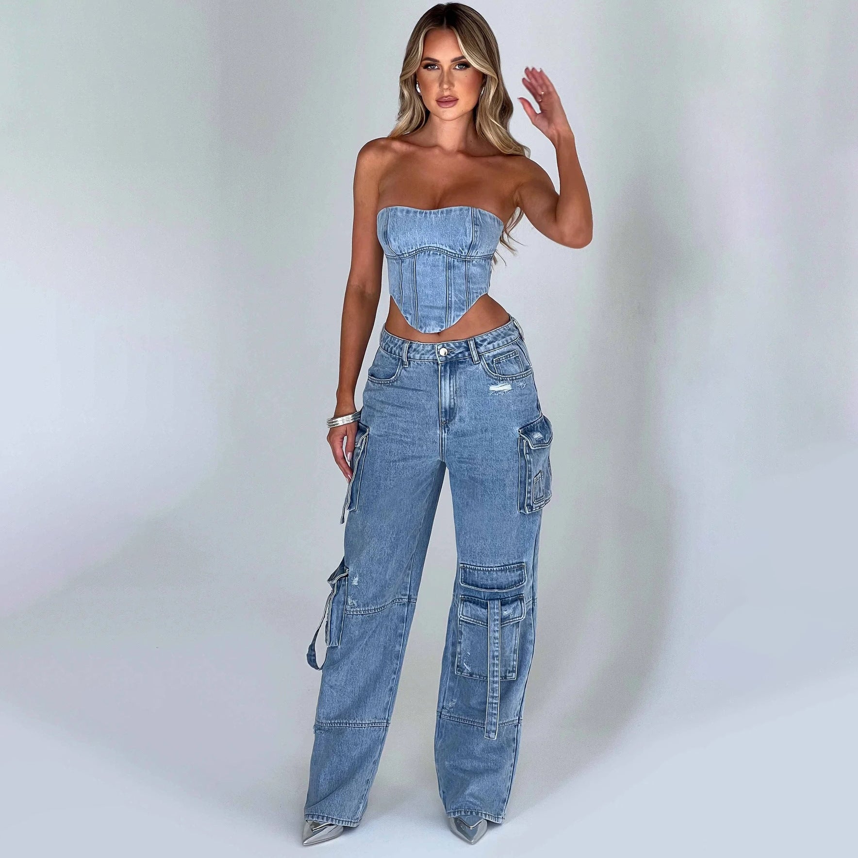 Traje de mujer de cintura baja, top tubo tridimensional y pantalones vaqueros con pespuntes y bolsillos