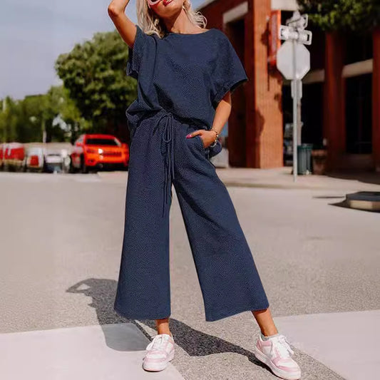 Conjunto de dos piezas de ropa de mujer informal con textura de color sólido, pantalones y manga corta