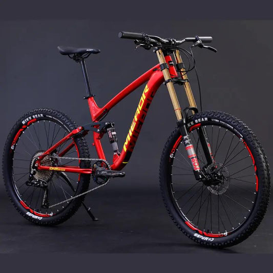 Aluminum soft-tail mountain bike by AdTec with red frame and gold front suspension fork.
