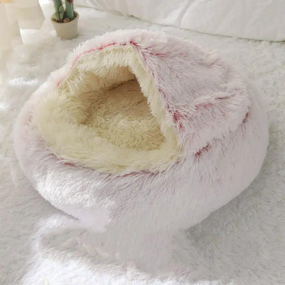 Crystal velvet warm round plush cat bed in pale pink with cream interior