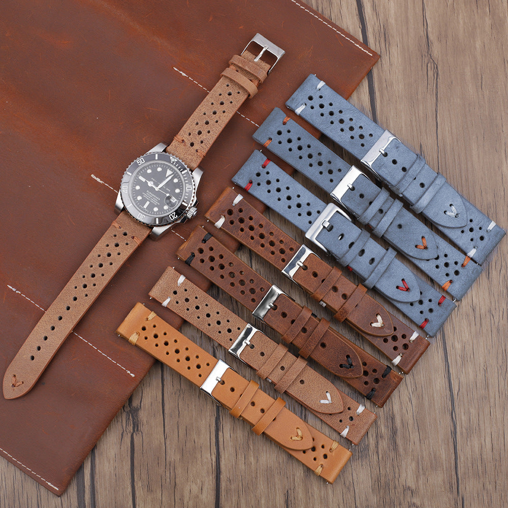 Correa de reloj de cuero gris azulado con costuras y múltiples orificios