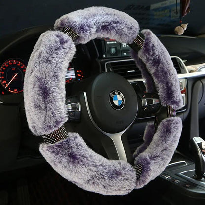 Steering wheel cover for car; plush purple fur on BMW wheel with diamond accents.