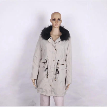 Women's mid-length beige parka with black faux fur collar, zip and button front, drawstring waist, zip pockets.