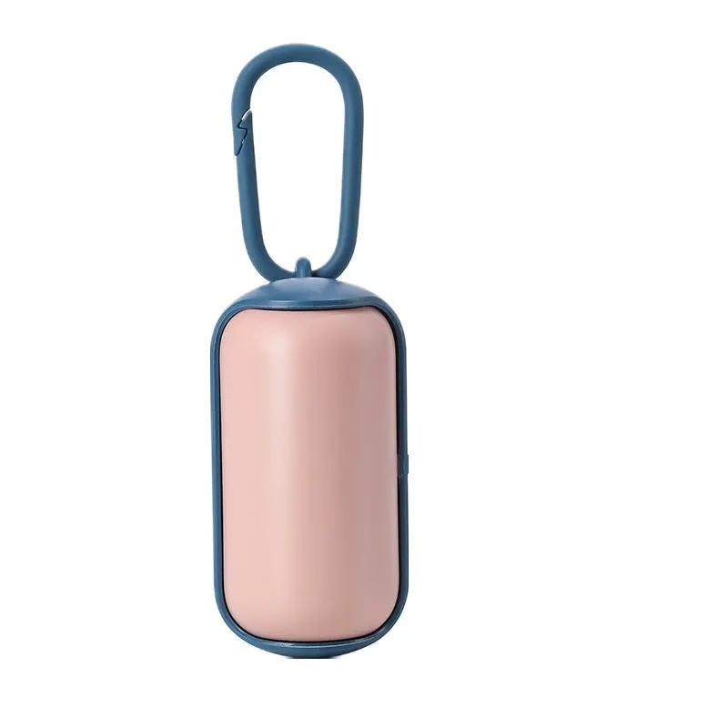Portable poop bag dispenser for cats and dogs with blue clip and pink body