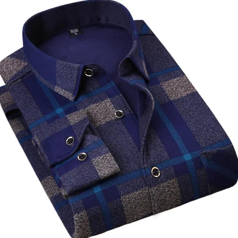 Mens fleece-lined navy blue plaid flannel shirt, folded.