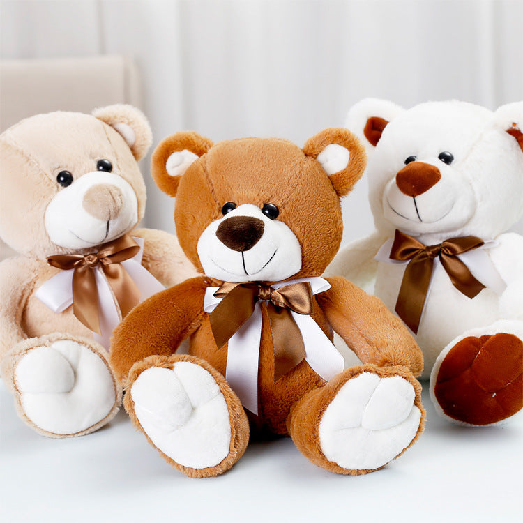 Bonito oso de peluche de dibujos animados con pajarita