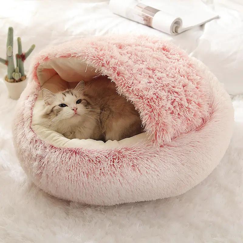 Plush pink shell pet nest with soft fluffy interior and cat inside.