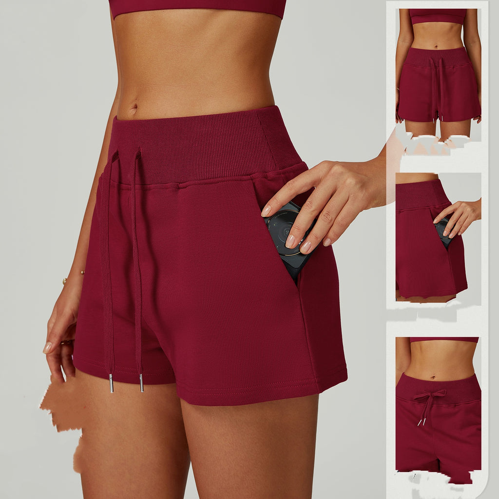 Short de sport molletonné taille haute avec cordon de serrage et poches pour l'extérieur
