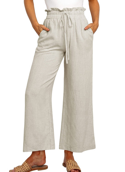 Pantalon large à taille élastique, lacets et coupe courte de couleur unie