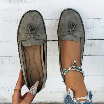 Pair of AdTec women's gray suede round-head loafers with tassel detail and non-slip sole